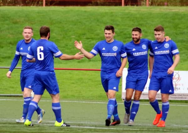 Dundonald players celebrate the second of Scott Lawrie's double against Broxburn on Saturday. Pic: Ian Cunningham