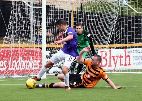 Kyle Wilkie of East Fife takes on Alloa's Andrew Graham (picture by Jim Corstorphine)