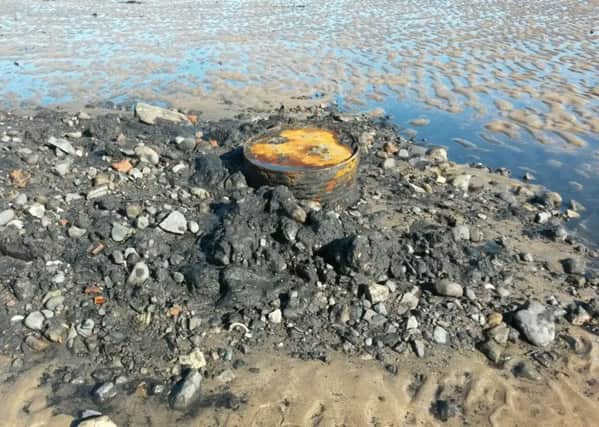 An oil drum was among the items of rubbish dumped on the beach