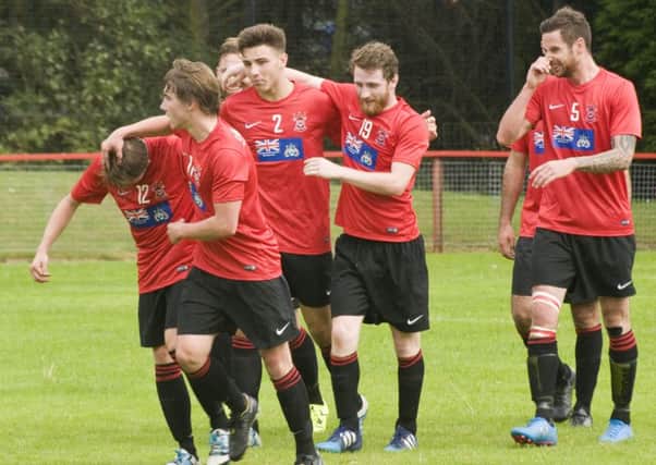 Liam Ross gets plaudits from Tayport players in the 3-1 home win over Whitburn (picture by Ron Nicol)