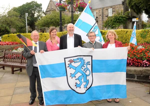 Robert Main, Linda Pearse, Cllr Neil Crooks, Jim Cooper & Joey Cottrell with flag of Ingolstadt to launch The Bavarian Festival. Pic: FPA