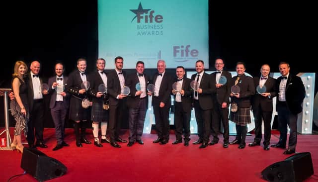 The winning companies at this year's Fife Business Awards 2016 with host Kaye Adams.