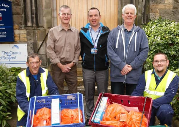 Foodbank volunteers: Hugh McKenzie, (right) and John Cullen with Craig Hutton (Fife Council project officer) and Unpaid Work clients, at Dysart Church.