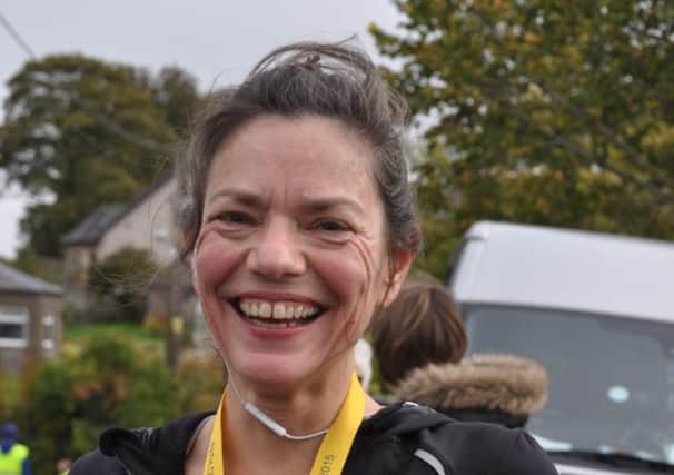 Cupar runner Carolyn Haddow undertook a challenge to run 100km - 10k a day for 10 days - to raise awareness of early onset Alzheimer's in light of her friend Euan developing the disease t only 56.