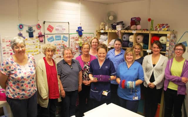 Members of the knitting group with NHS Fife staff