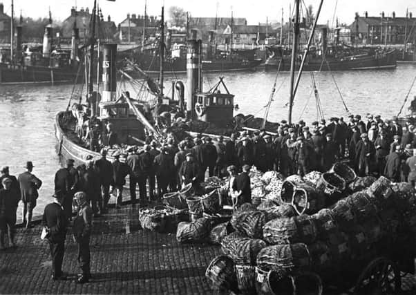 A busy harbour during the days of a thriving east coast herring fishing industry