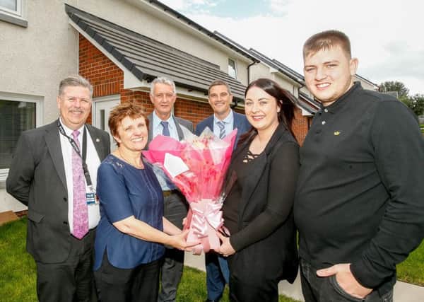 Handing over the keys to the new houses at Steelworks Brae in Methil