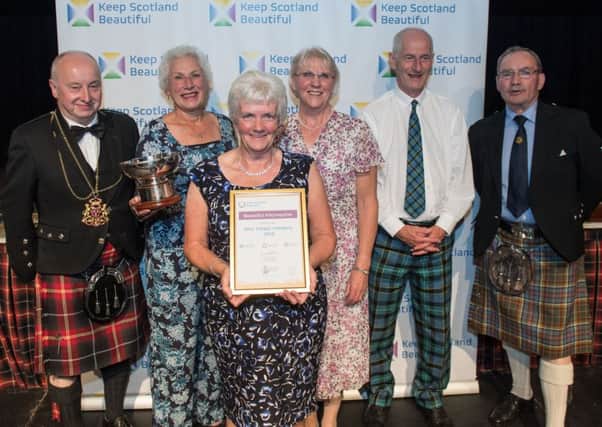 Members of the Beautiful Kilconquhar team received their Beautiful Scotland Award from George Anderson of the BBCs Beechgrove Garden (right) and Aberdeen's Lord Provost George Adam (right).