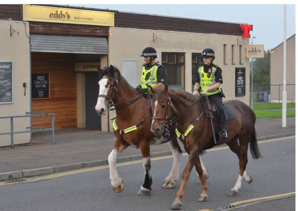 Mounted police outside Eddy's Bar in Kirkcaldy, which is hosting Wednesday's meeting (picture by George McLuskie)