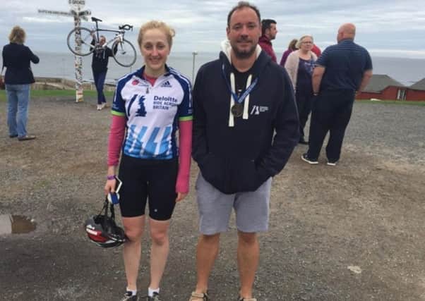 Rosalind Kilgrour and Chris Wallard at John O'Groats at the end of their charity cycle ride.
