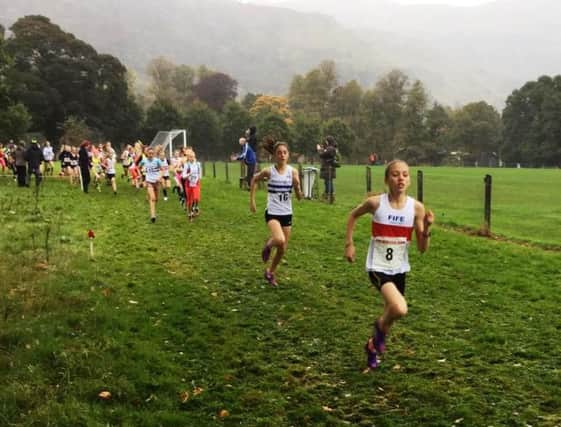 Anna Hedley (Fife AC) takes an early lead in the Under 13 girl's race at the East of Scotland Cross-Country League at Stirling going on to a 39 seconds victory ahead of No.16 Emma Johnson (Edinburgh AC).