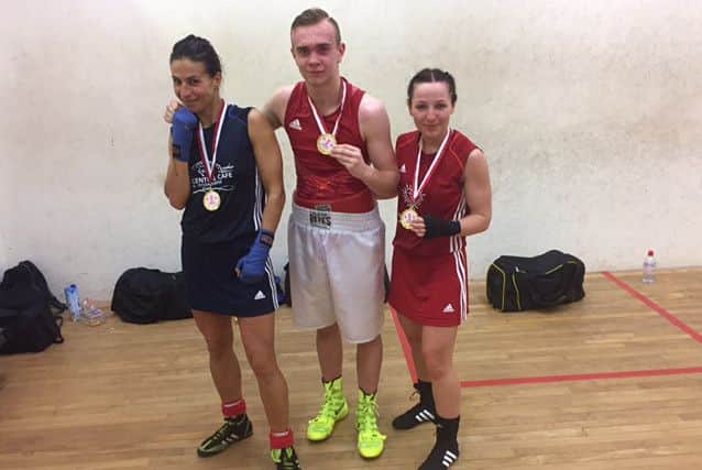 Effy Kathopouli, Bradley Innes and Emma McCulloch with their gold medals won in Liverpool.