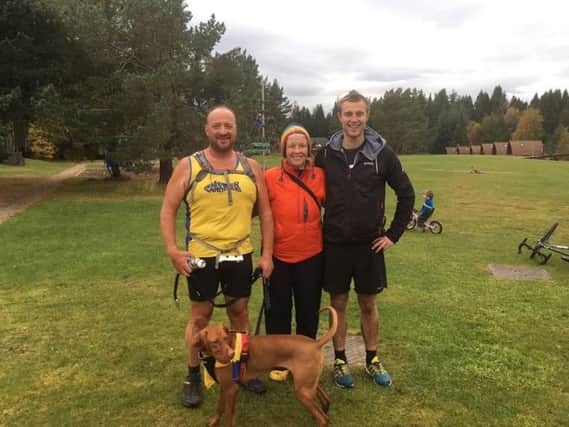 George and Debz Hay with Thomas Knox and mascot Willow, at  the Meall a Bhauchaille hill race.