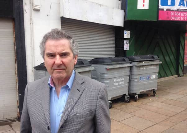 Kirkcaldy MP Roger Mullin with the unpopular bins which have now been moved