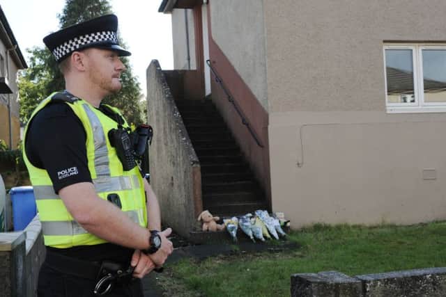 Tributes to Violet-Ivy outside the home on Kinloss Crescent. Pic. George Mcluskie.