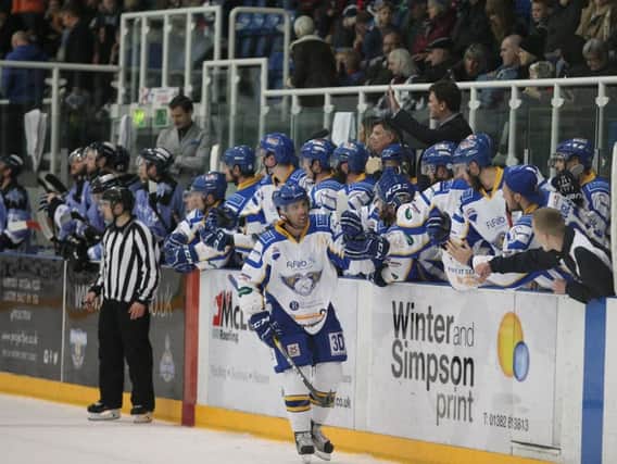 Kyle Haines celebrates with the bench after his late goal put the seal on Fife Flyers win over Dundee Stars. Pic: Derek Black