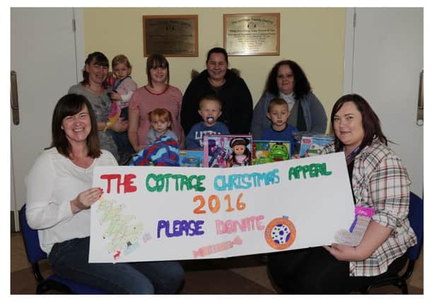 Staff and families from the Cottage Family Centre launch the festive appeal. Pic by George McLuskie