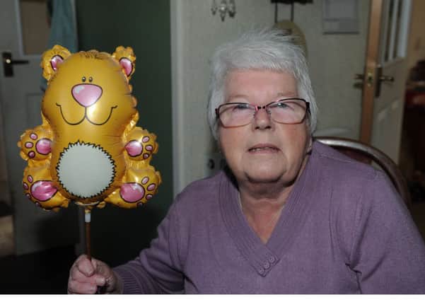 Mary Wallace who was bought a helium balloon in 1995 after a hip operation and it's still going strong 21 years later. (Pic George McLuskie).