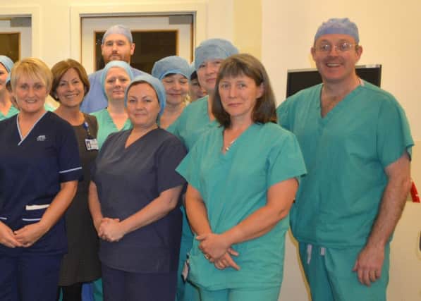 Mr Dunstan with his team following the successful surgeries.