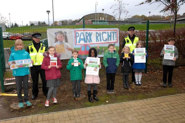 Some of the pupils getting the message across, with help from local traffic wardens. Pic by FPA