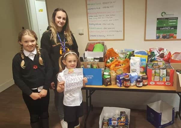Carla McDowell (left) and Aubry Laing who separately did a bake sale and collected food donations for Cottage Family Centre's Christmas Appeal to help families in need.