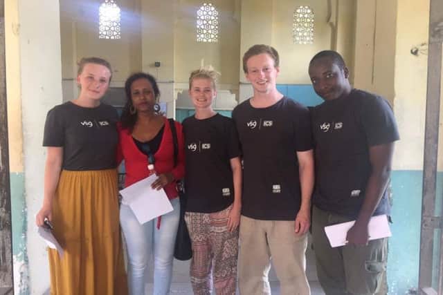 Alasdair Pilmer and some of the other volunteers with townsfolk in Zanzibar