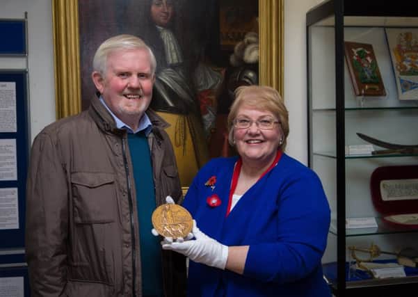 Linda Ballingall, Heritage Centre chairman with Ian Nimmo-White who is conducting research with the hope of reuniting the family with the soldier's death plaque. (Pic Steve Brown).