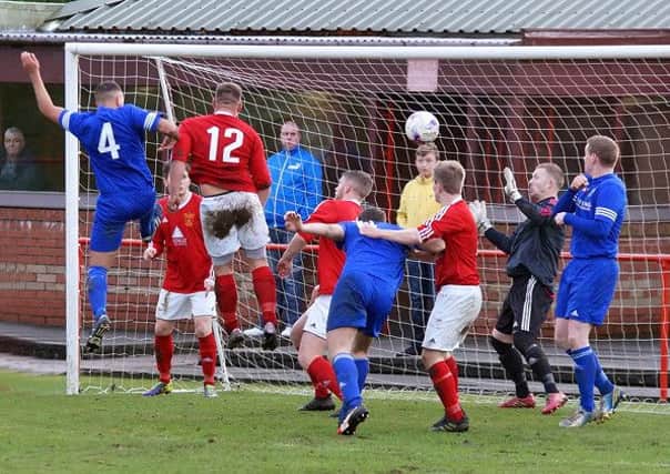 A Dundonald header finds the net in the 4-4 draw with Hill of Beath on Saturday. Pic: George Wallace