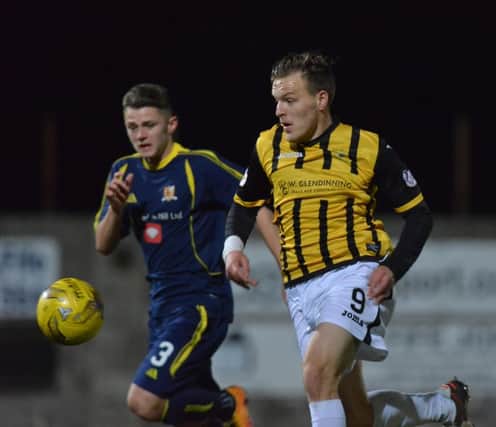 Jamie Insall breaks clear of the Alloa defence.