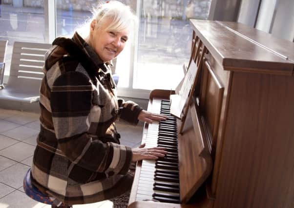 Betty Corstorphine from St Andrews tries the bus station piano