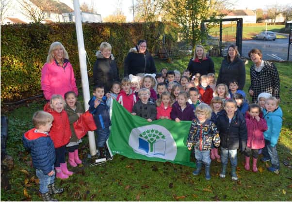 Carleton Nursery staff and youngsters proudly display their Green Flag (picture by George McLuskie)