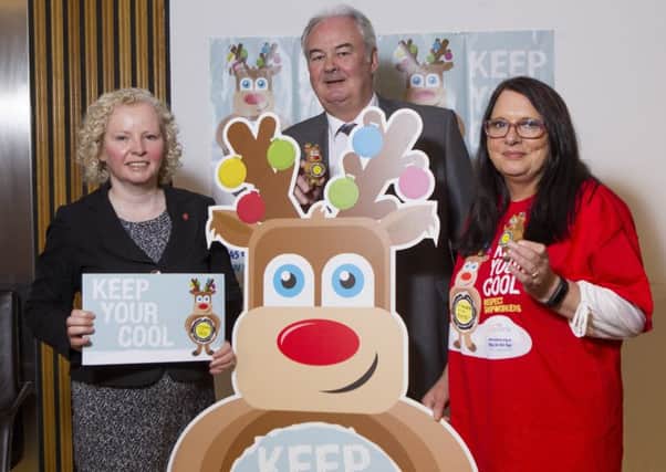 Scottish Labour MSP Claire Baker with Lawrence Wason Divisional Officer and Jacqueline Martin Usda member and Clive the reindeer for Usdaw at The Scottish Parliament