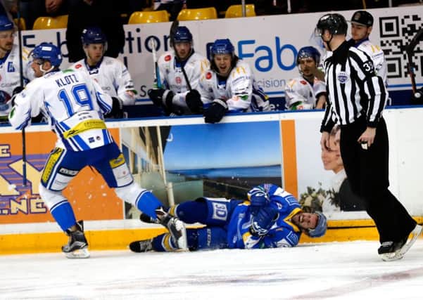 Ric Jackman lies on the ice after the hit from Garrett Klotz took him out of the game (PIc: Steve Gunn)