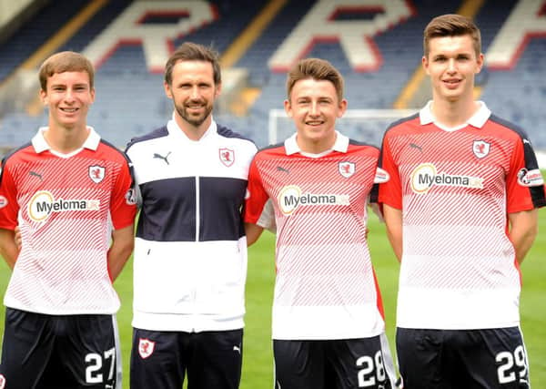 Raith development coach Craig Easton with young players James Berry, Ryan Stevenson and David McKay - credit - FPA  -
