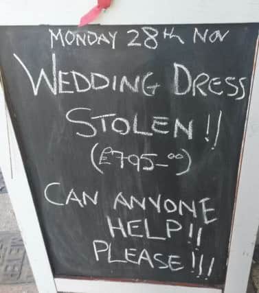 The shop is seeking help to find the stolen dress.