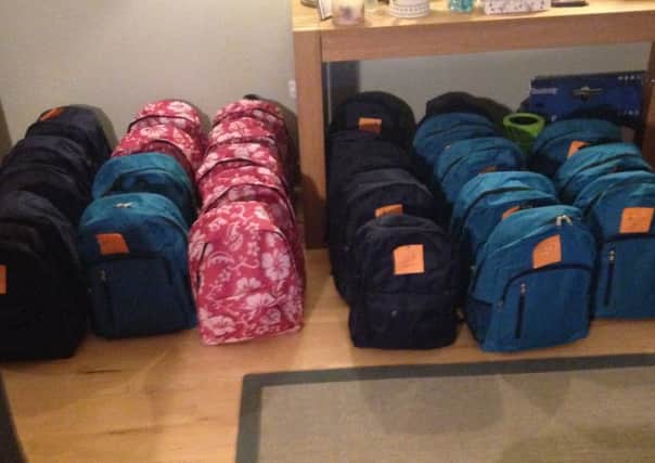 Backpacks for refugees filled by Fife workers