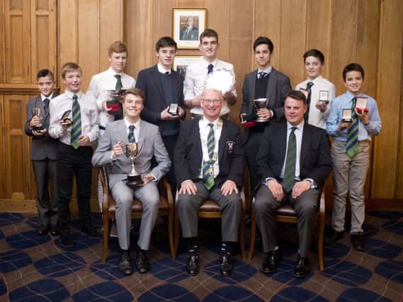 The junior team with New Golf Club captain John Mitchell, junior convener Dale Caton, 2017 junior captain Ben McKay, and the main prize winners in the year.