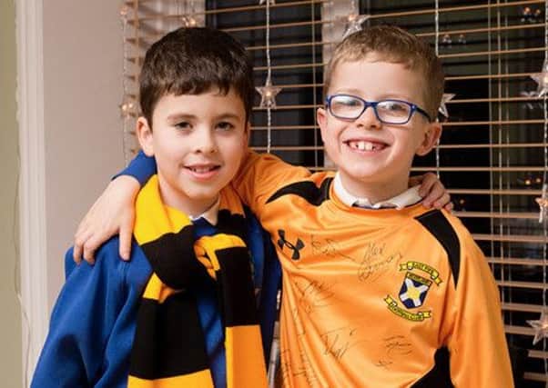 Eight-year-old twins Alfie, right, and Robbie Dalrymple, of St Andrews. Robbie wrote to East Fife FC applying for the job as the new manager. (Picture: Peter Adamson.)