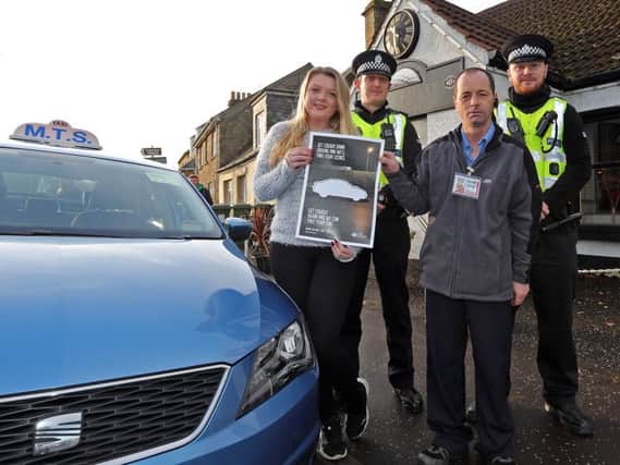 Pictured outside the Golf Tavern in Cupar, front -  Caitlin Anderson of the Golf Tavern and  taxi driver James Blyth. Back - PC Kevin Adam (left) and PC Robert Crawford. Pic: Dave Scott