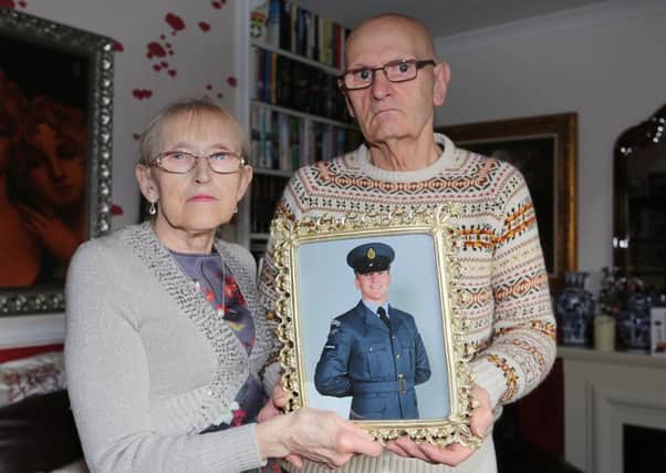 Mary and Oliver McKeague with a picture of their grandson Corrie, who's been missing for over three months  (photo: Dave Scott)