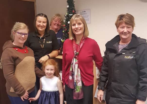 Maisie Rose with mum, Michelle and Frontline Fife staff.