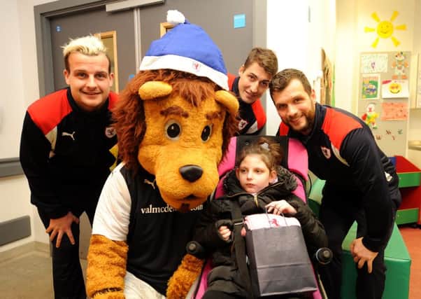 Raith Rovers players and Roary the mascot visited the children's ward at Victoria Hospital this week. Pictured with Chloe Annan, age 7, are Kyle Benedictus, Rudi Skacel and Kevin Cuthbert - credit - fife photo agency -