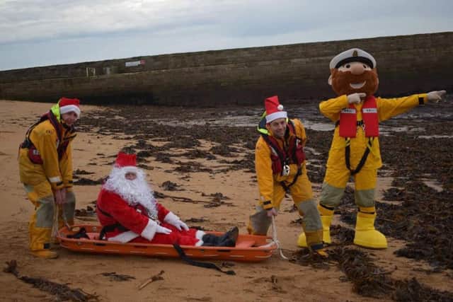 Santa joined the RNLI for the festive snaps.