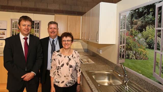 Ken Gourlay, Head of Housing (Asset and Facilities Management), John Mills, Head of Housing and Councillor Judy Hamilton, executive spokesman for Housing and Building Services