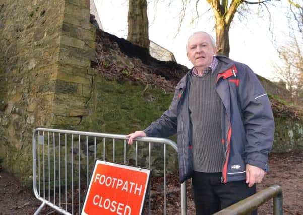 Leslie resident Brian Coyle at the site where the wall collapsed. (Pic Gerorge McLuskie).