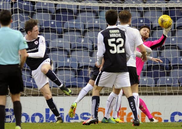 Declan McManus is denied a much-needed goal by a wonder save from Falkirk goalkeeper Danny Rodgers on Saturday. Pic: Michael Gillen