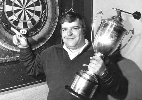 Jocky Wilson in Kirkcaldy with the Embassy Darts World Championship trophy in 1982
