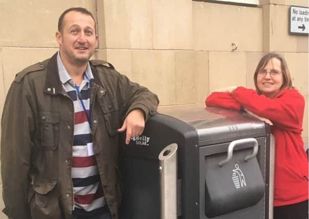 David Angus and Jane Kell with the new bin in Market Street, St Andrews.