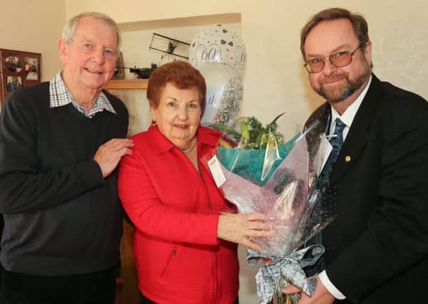 John and Margaret Smith with Councillor John Docherty, right (picture by Andrew Beveridge).
