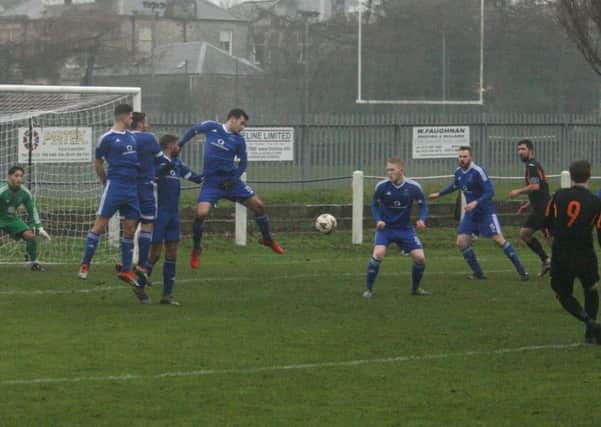 St Andrews United are forced to defend a Dalkeith set-piece.